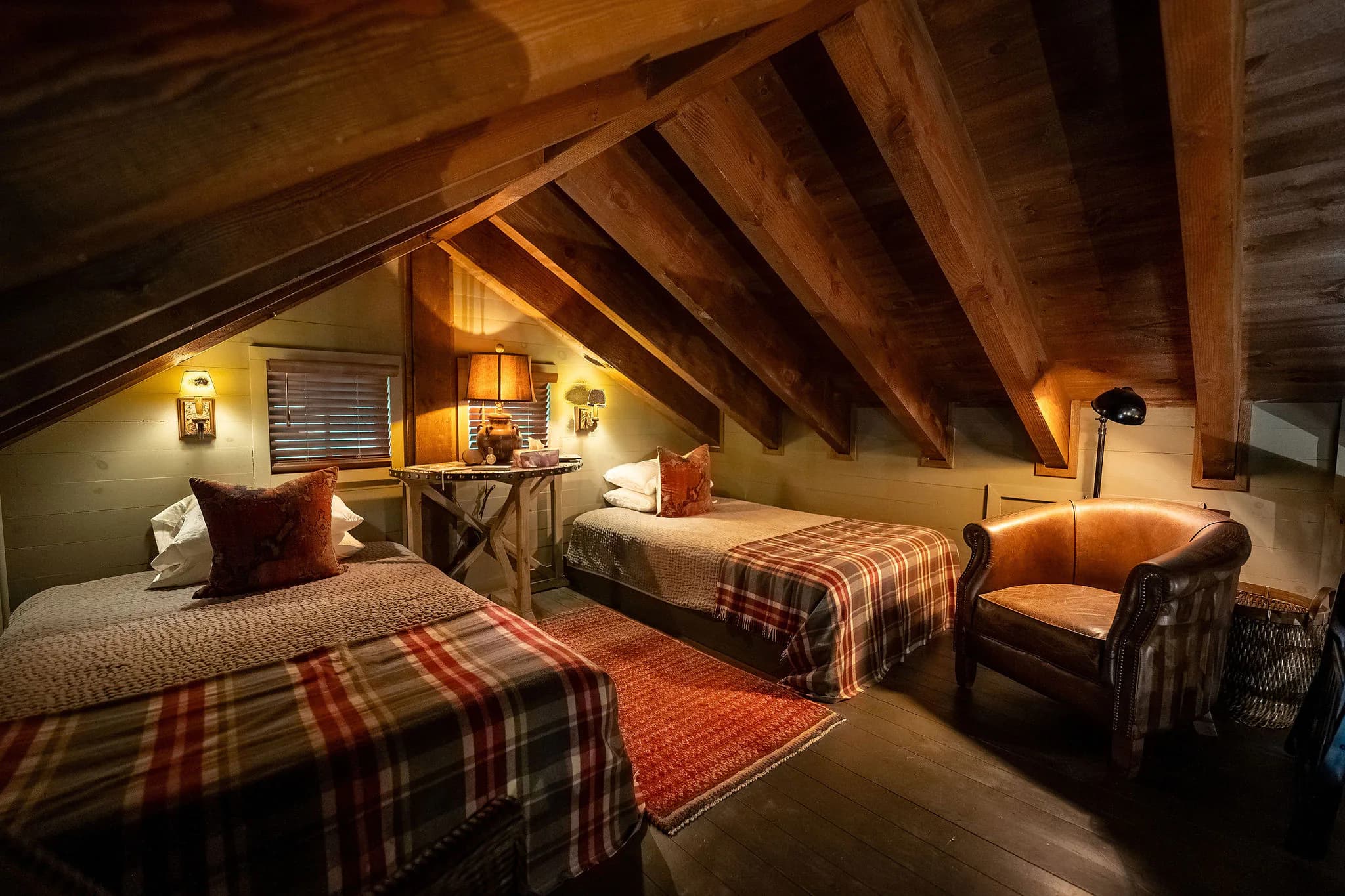 Ladder loft with two twin beds under the rafters of a Marietta SC cabin rental